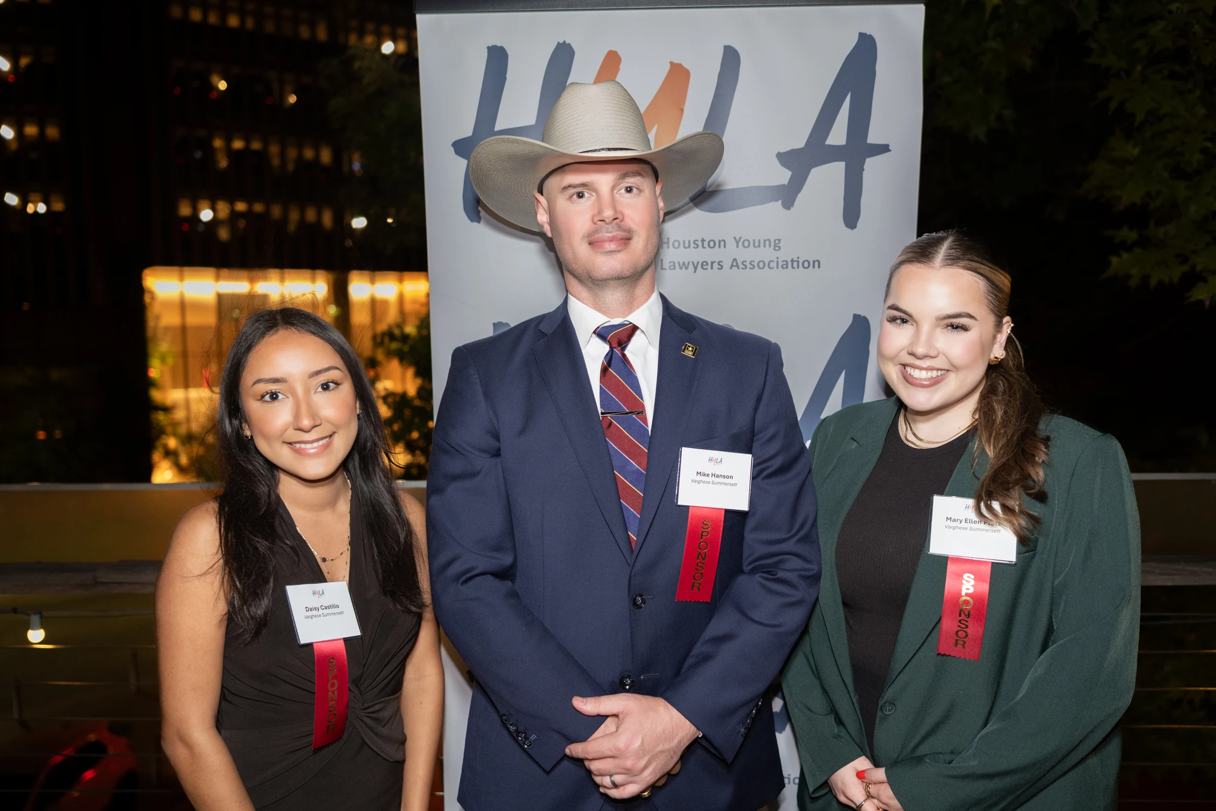 Three guests together at a reception